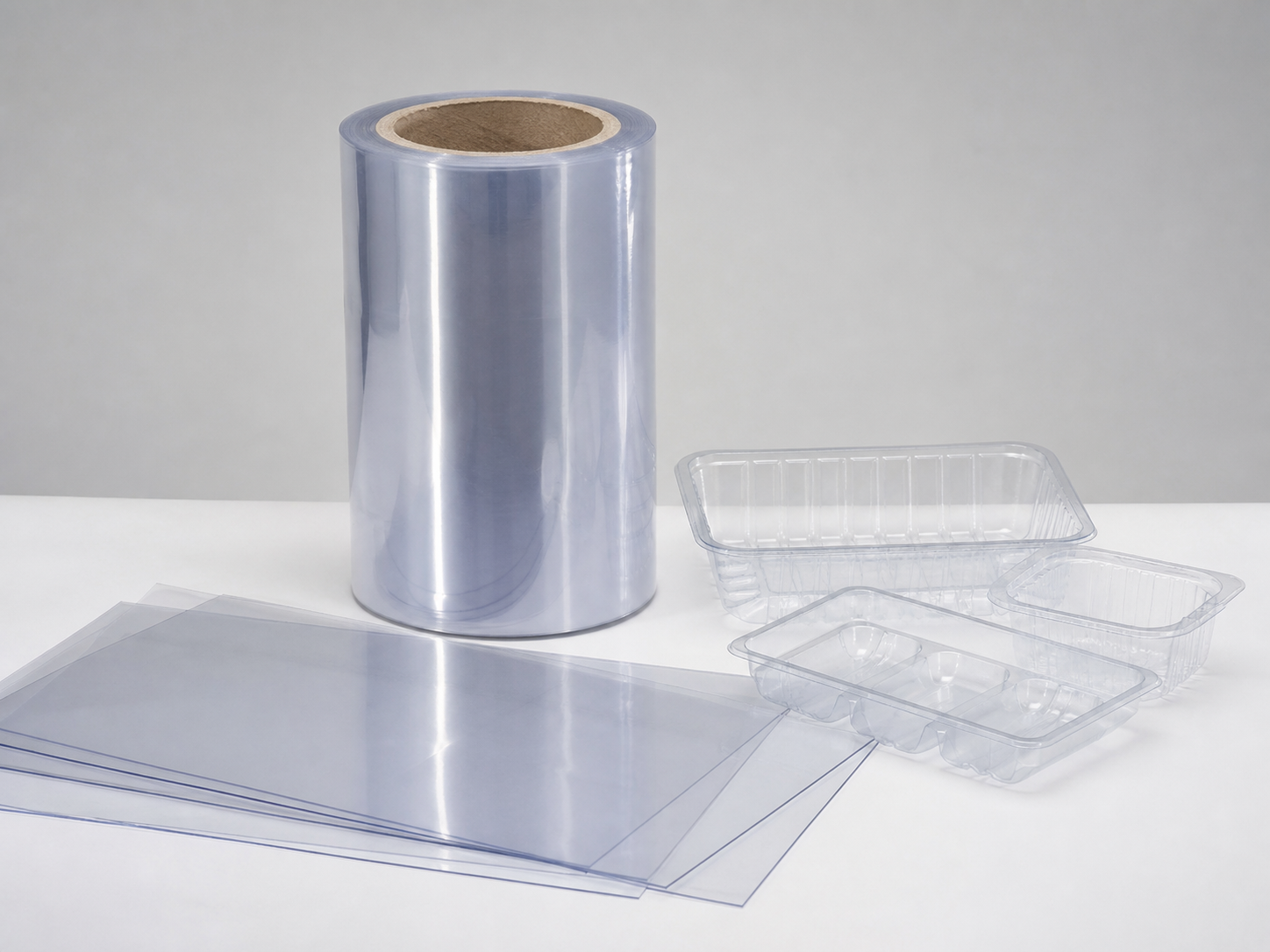 Clear RPET and PET sheet roll with transparent packaging tray samples for sustainable packaging applications